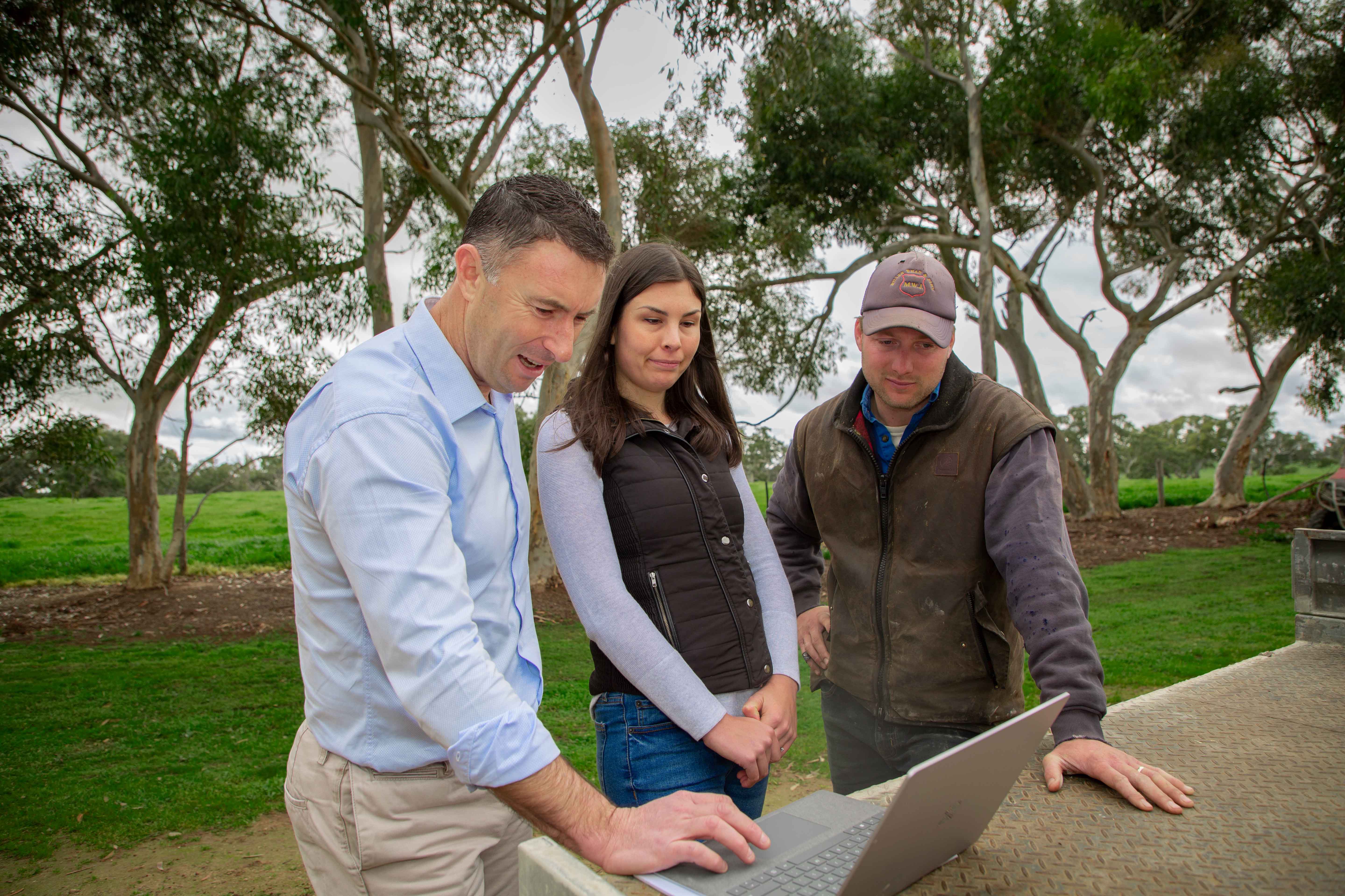 A farmer and his adviser talking over the farm's figures